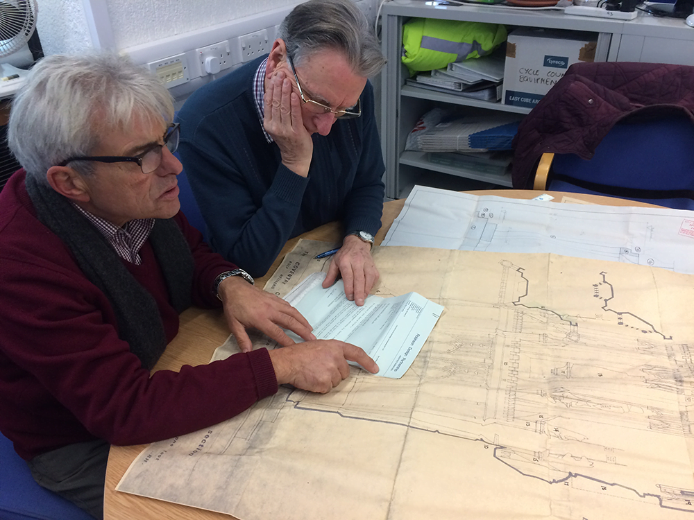Jim Holland and Ian Walden OBE checking out plans of the Coventry Cross Monument